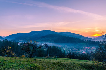 Fototapeta na wymiar Ukrainian Carpathian Mountains landscape background during the sunset in the autumn season