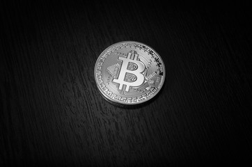 White bitcoin on a black background