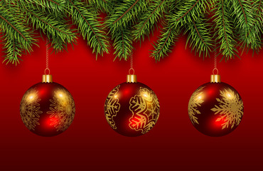 Christmas baubles red and gold with green pine tree