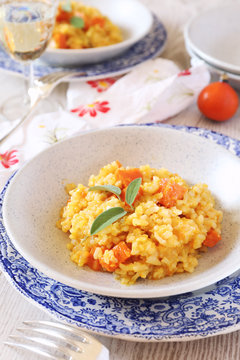 Pumpkin risotto and glass of white wine