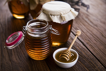 Fresh honey on wooden table