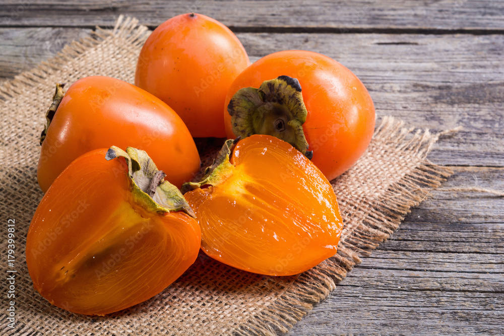 Wall mural delicious ripe persimmon fruit