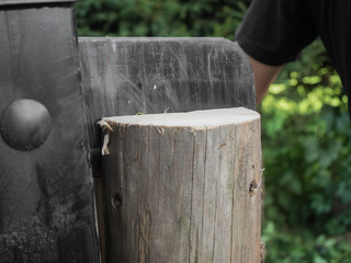Firewood split with wooden splitter