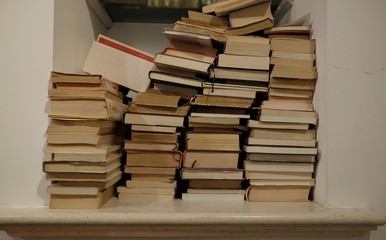 books piled in the library
