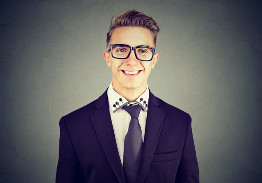 Happy young man with glasses, smiling