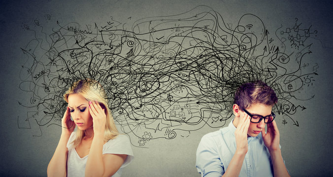 Preoccupied anxious couple woman and man looking away from each other exchanging with many negative thoughts