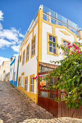 Fototapeta na wymiar Beautiful narrow street of Alvor, Portugal