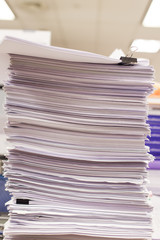 Pile of papers and document stacked on the table close up.