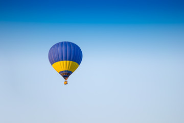 Colorful of hot air balloon with fire and blue sky background