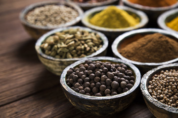 Close-up of different types of Assorted Spices in a wooden