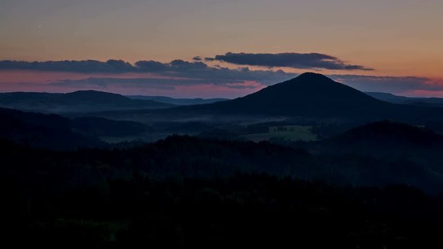 timelapse of sunset over the Ruzovsky vrch, highest peak of national park Bohemian Switzerland, Czech Republic, UHD 4K