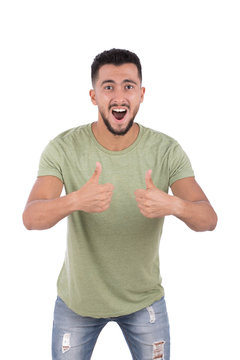 Happy adult man is standing proud and making a like gesture. Isolated on white background.