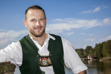 bavarian tradition man at the lake