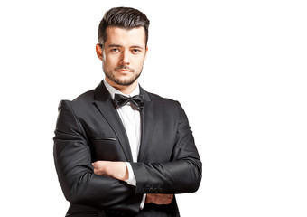 portrait of confident handsome man in black suit with bowtie