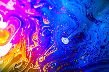 Beautiful psychedelic abstraction formed by light on the surface of a soap bubble
