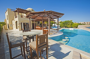 Swimming pool at at luxury tropical holiday villa resort