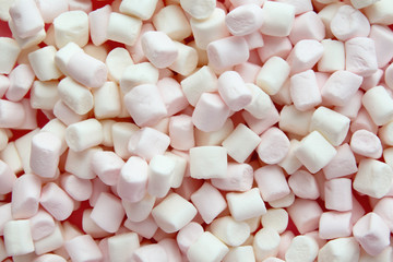 Soft pink and white marshmallows background.