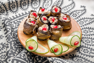 Rustic fried stuffed eggplant with cheese and meat decorated  arugula