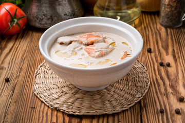 bowl of creamy soup with salmon