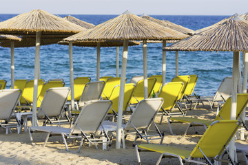 Beach with deck chairs and sunshades