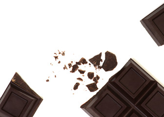 Broken chocolate bar isolated on white