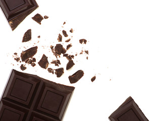 Broken chocolate bar isolated on white