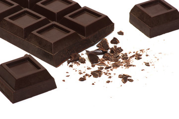 Broken chocolate bar isolated on white