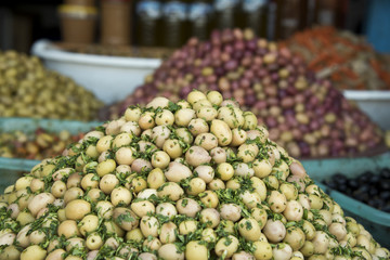 Large bowls of Green & Pink Olives for sale in a Moroccan Market