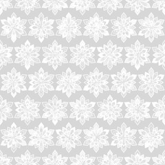 Abstract seamless pattern. It consists of snowflakes, evenly located on a gray background. For your winter design.