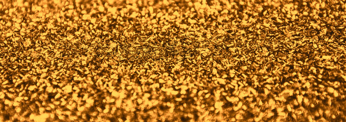 Golden glittering Christmas lights. Festive abstract glitter background.