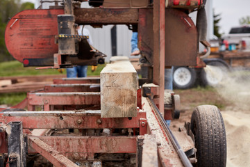Lumber being cut and processed at a sawmill