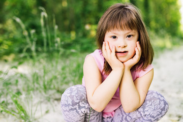 Fototapeta premium Portrait of young girl with down syndrome