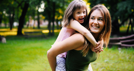 Little girl with special needs enjoy spending time with mother