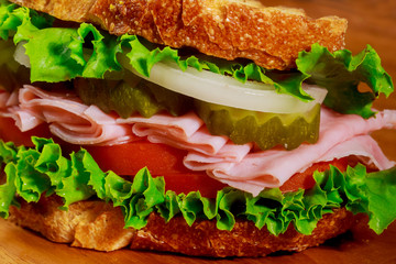 Sandwich with lettuce, tomato, ham and cheese