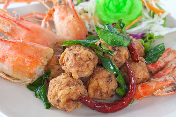 fried shrimp ball with head shrimp on white plate on white background