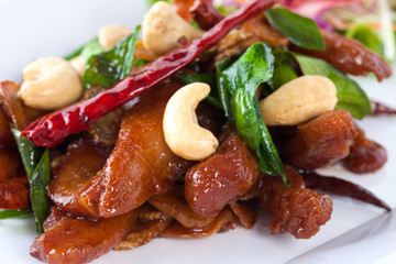 fried pork on white plate on white background