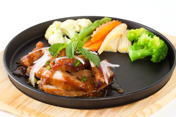pork neck grill isolated on black plate on white background (Thai style food)