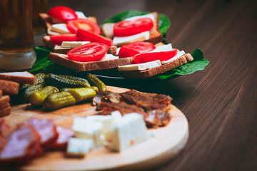 Plate with fresh aperitifs on the table