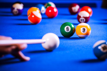 billiard balls in a blue pool table