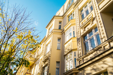yellow residential facade from low angle view