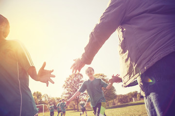 High Five line after a childs soccer game