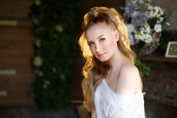 Naklejka premium Romantic blonde. Young beautiful cute woman. Beauty girl with long shiny hair, glowing skin and voluminous haircut