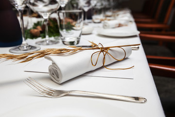 folded napkin laid with malt on the table at restaurant