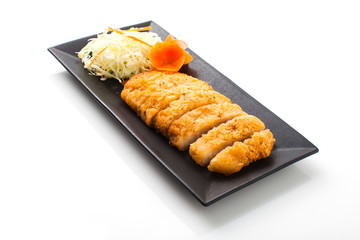 deep fried dory fish on black plate on white background