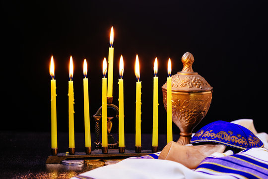 jewish holiday Hanukkah background with menorah traditional candelabra and burning candles
