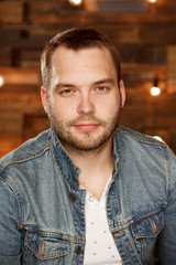 Portrait of a man on a wooden background