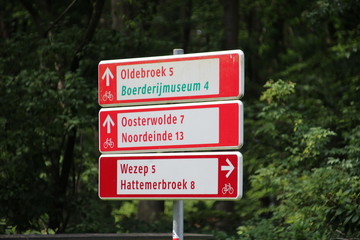 Direction signs in white and red dor cyclist in the Netherlands