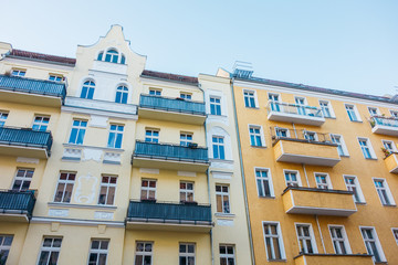 yellow and orange residential houses in low angle view