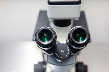 Close up of stereo microscope eyepieces in the laboratory - Powered by Adobe