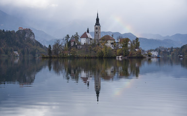 Rainbow over the church on the island of Bled lake, Slovenia